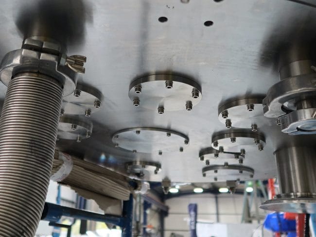 Stainless steel pressure vessel base with flanged ports and flexible connections