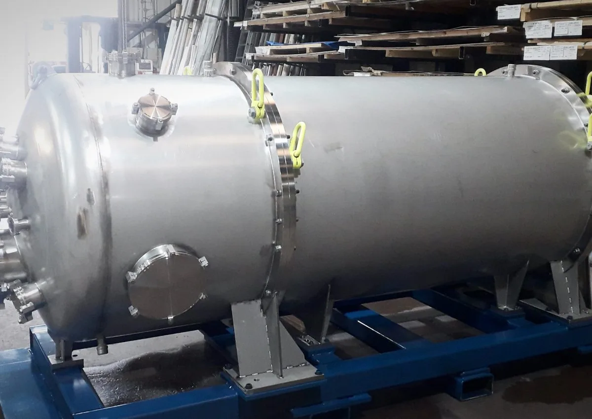 Fabricated stainless steel pressure vessel mounted on support frame in UK workshop