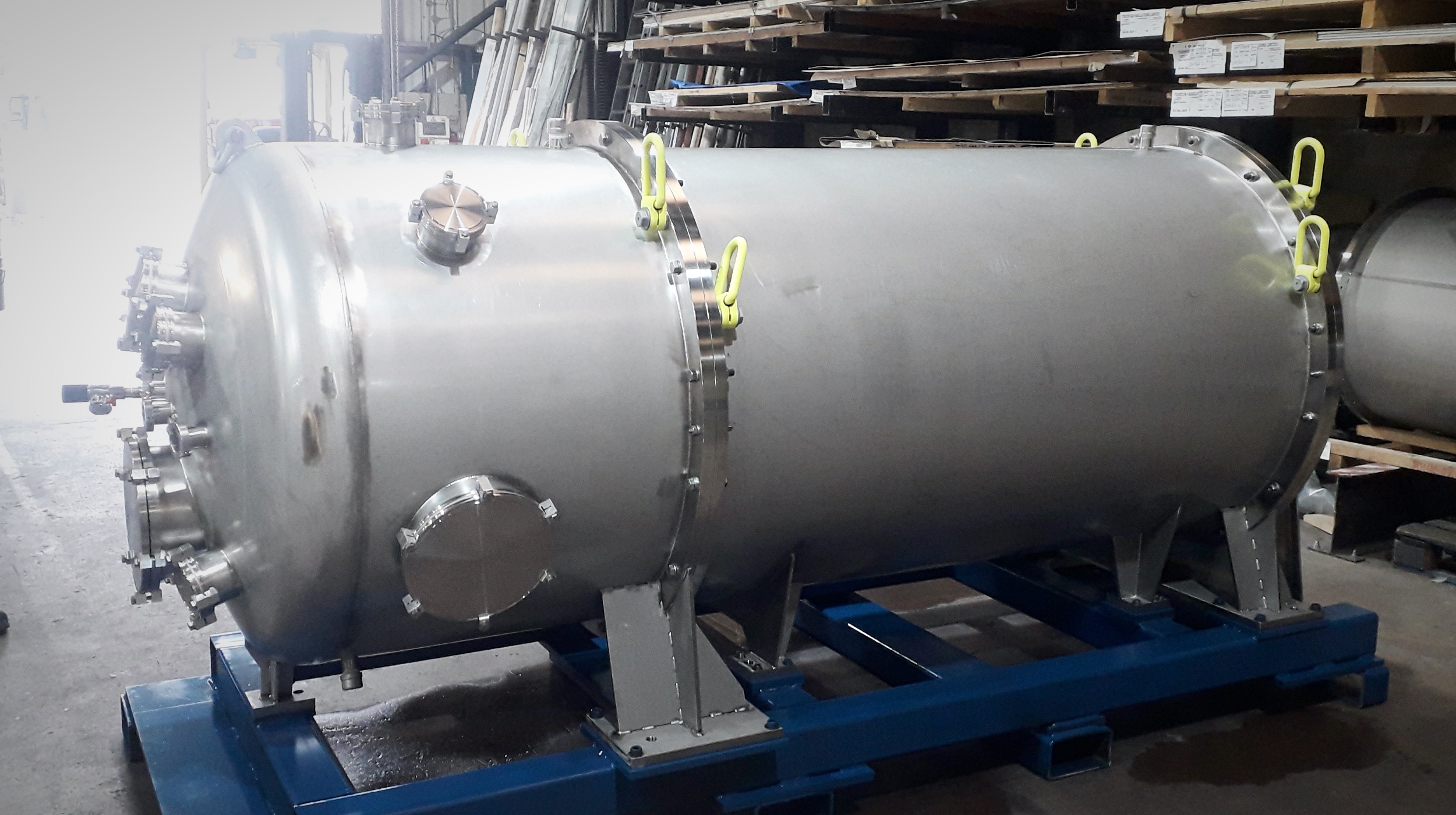Fabricated stainless steel pressure vessel mounted on support frame in UK workshop